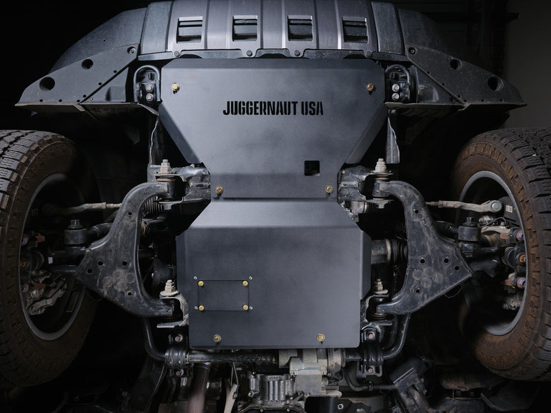 Juggernaut USA engine skid plate installed under a Toyota Land Cruiser, front view