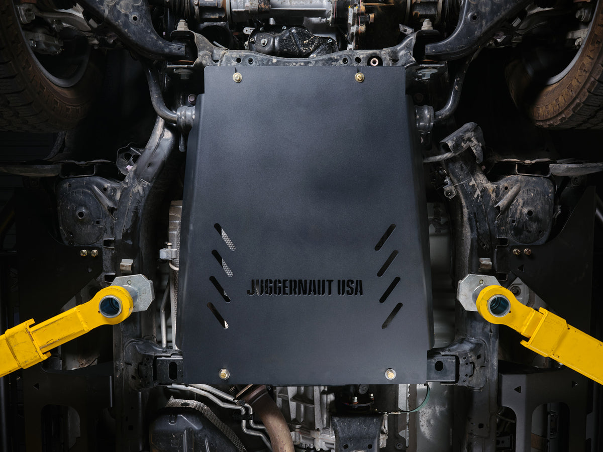 Juggernaut USA transmission skid plate installed under a Toyota Land Cruiser