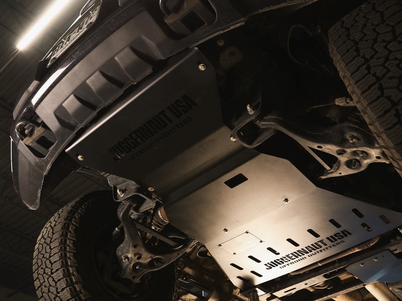 F-150 skid plate installation showing bolt-on aluminum armor protection
