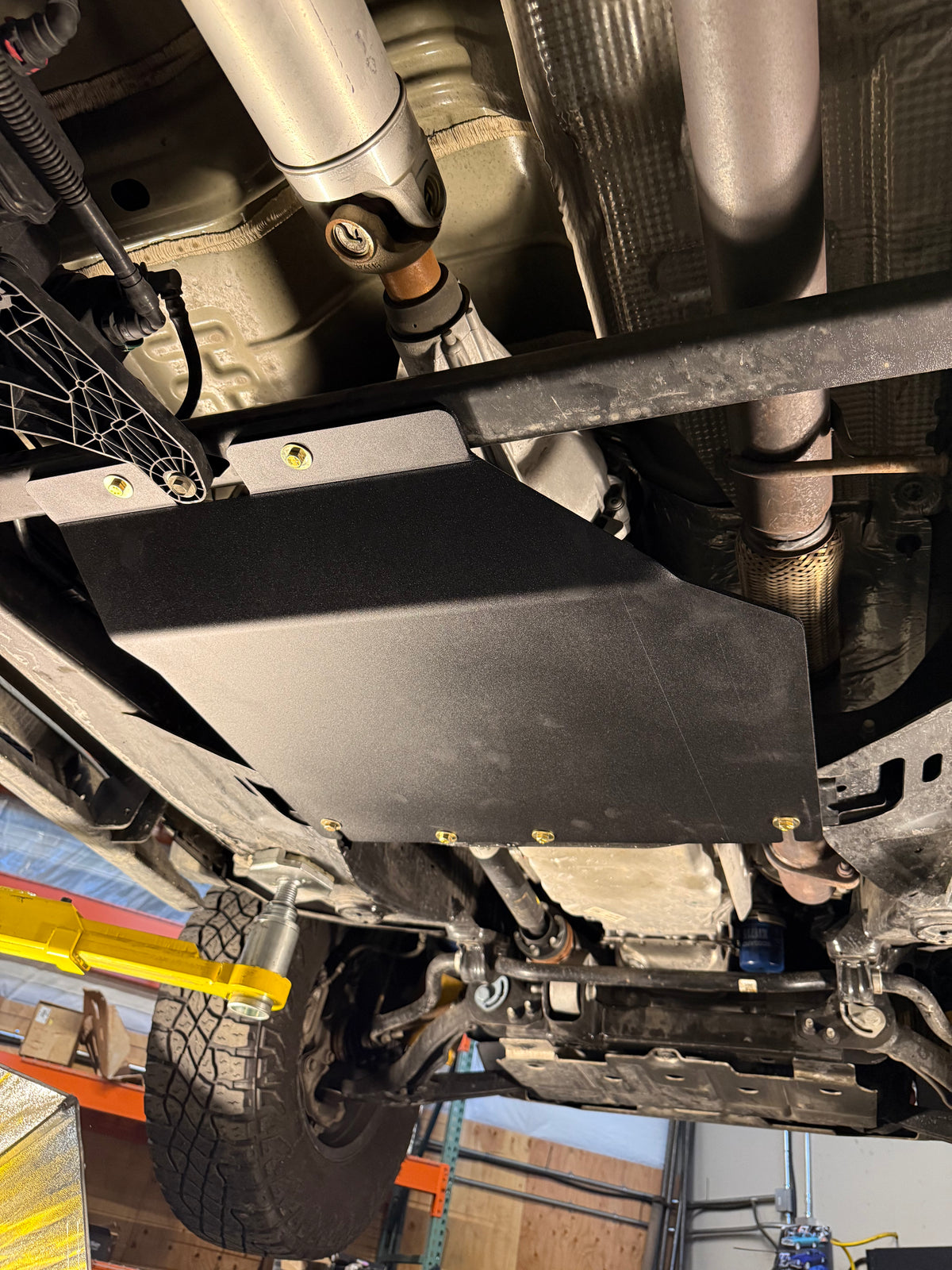 2023-2026 Chevy Colorado Transfer Case Skid Plate / GMC Canyon Transfer Case Skid Plate — CNC-cut 1/4 inch aluminum, made in Colorado by Juggernaut USA (view 3)