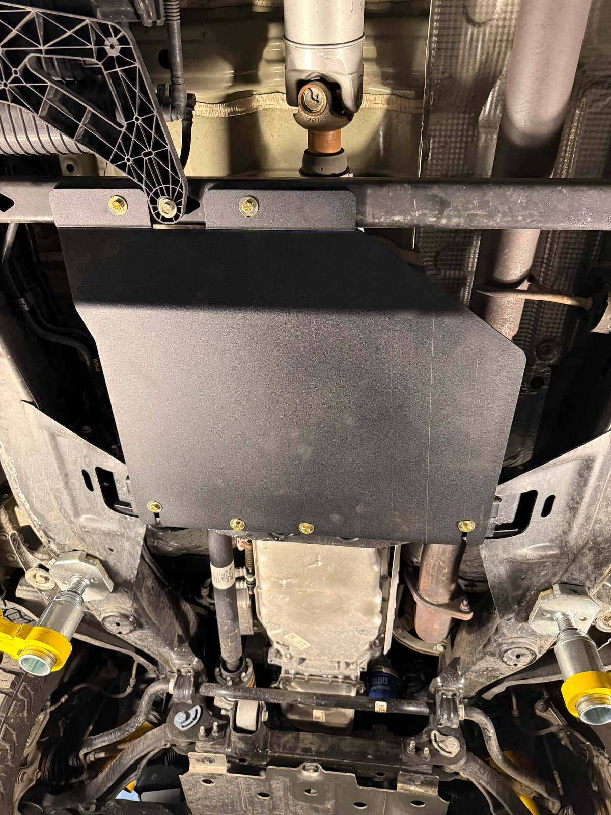 2023-2026 Chevy Colorado Transfer Case Skid Plate / GMC Canyon Transfer Case Skid Plate — CNC-cut 1/4 inch aluminum, made in Colorado by Juggernaut USA